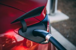 Tesla Model 3 Charging Photo by Vlad Tchompalov on Unsplash